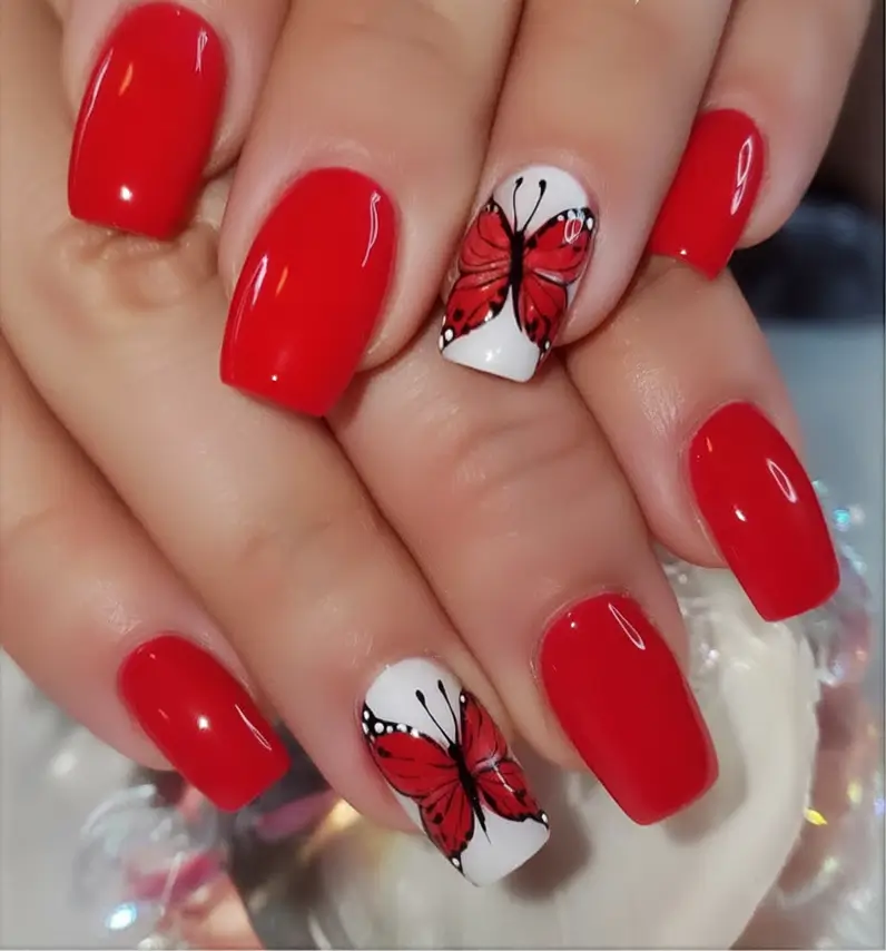 Bold Red Nails for 2025 Summer Vibrant Scarlet with Butterfly Accent