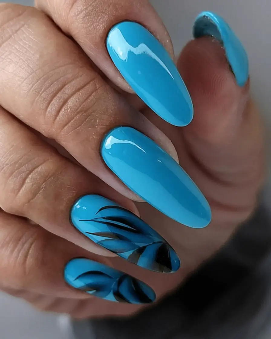 Chill Blue Nails for Summer 2025 Leafy Accents on Tropical Sky Blue