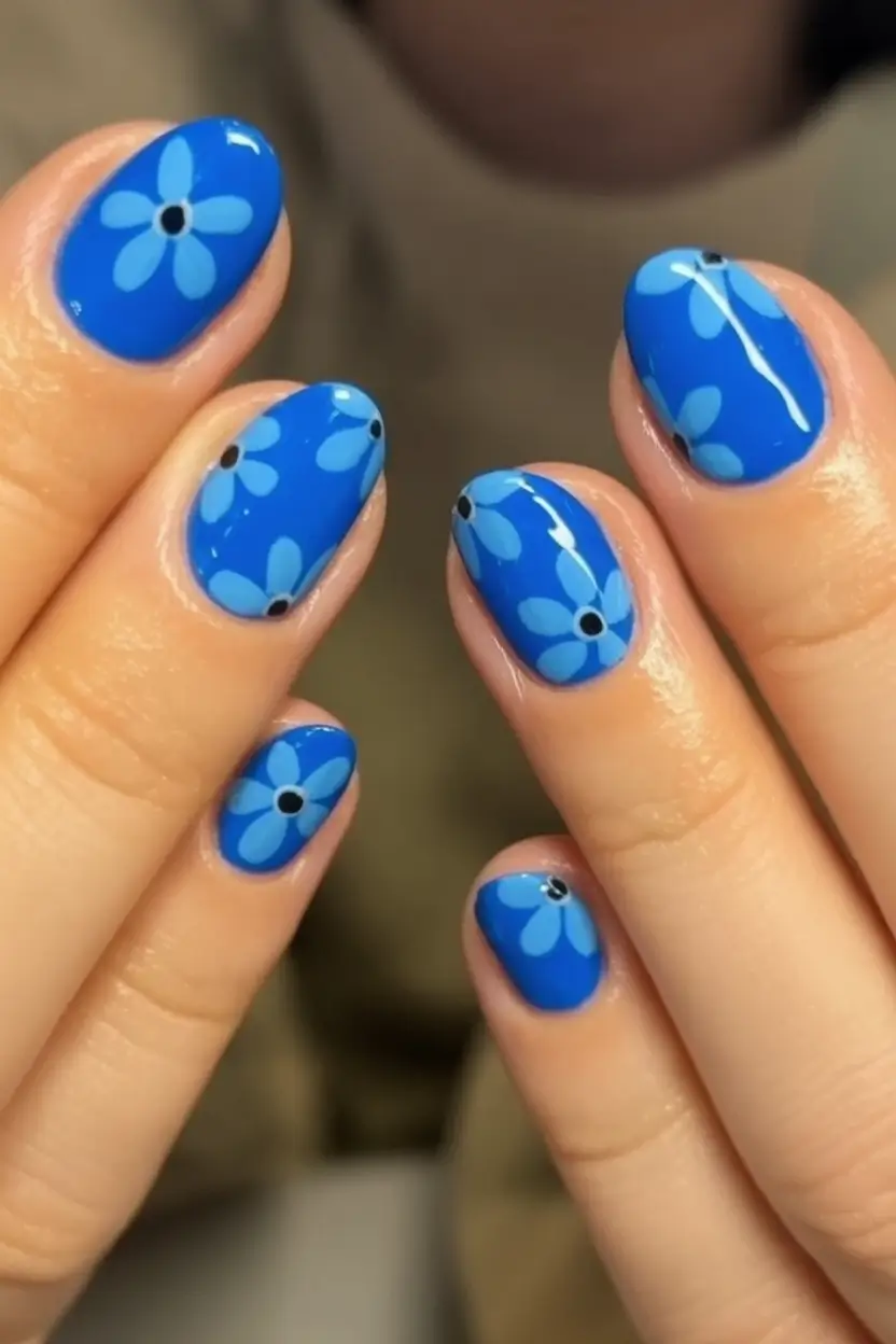 Cute Summer Nails You’ll Love in 2025 Blue Floral Pop On Glossy Bed