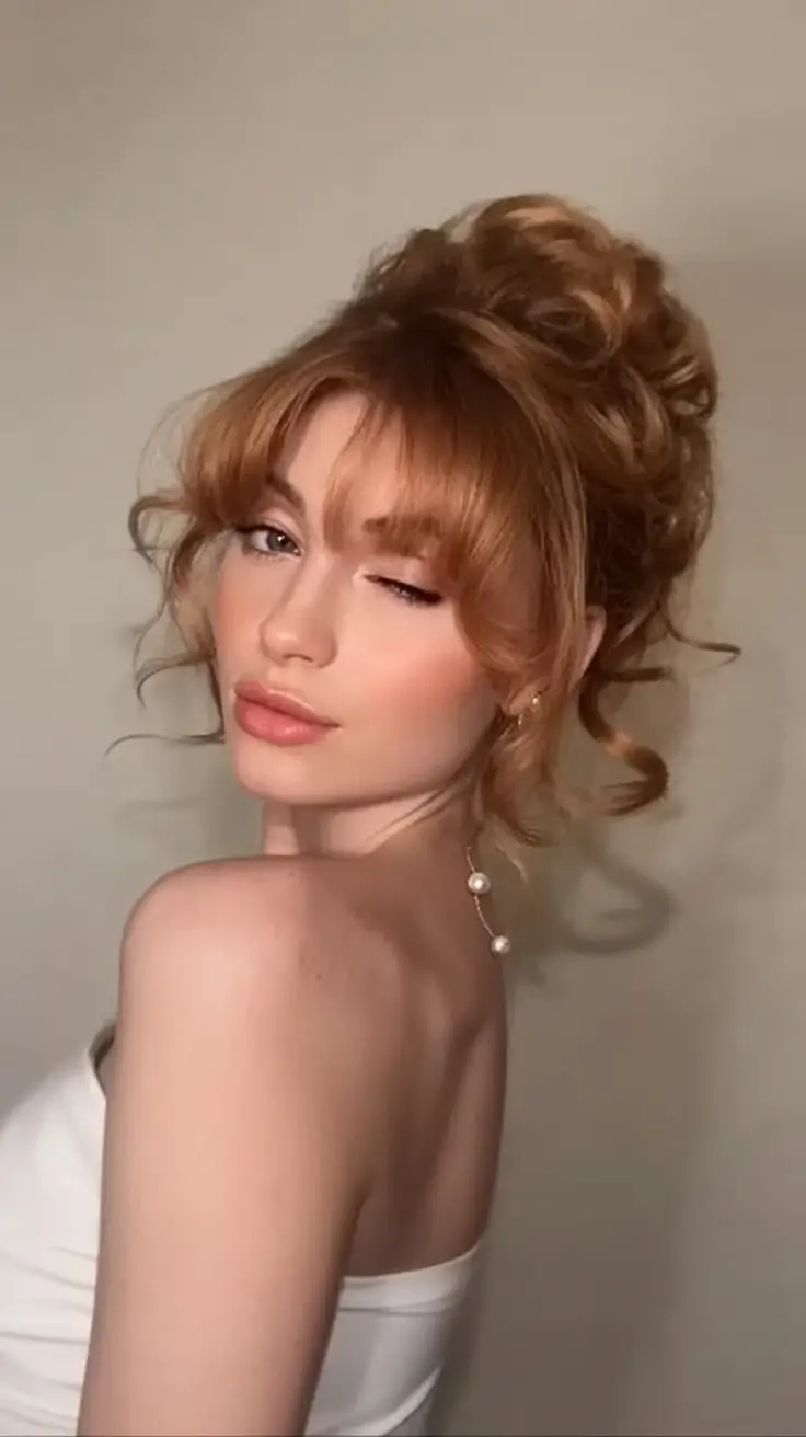 easy summer hairstyles 2025 Voluminous Ginger Updo with Wispy Bangs