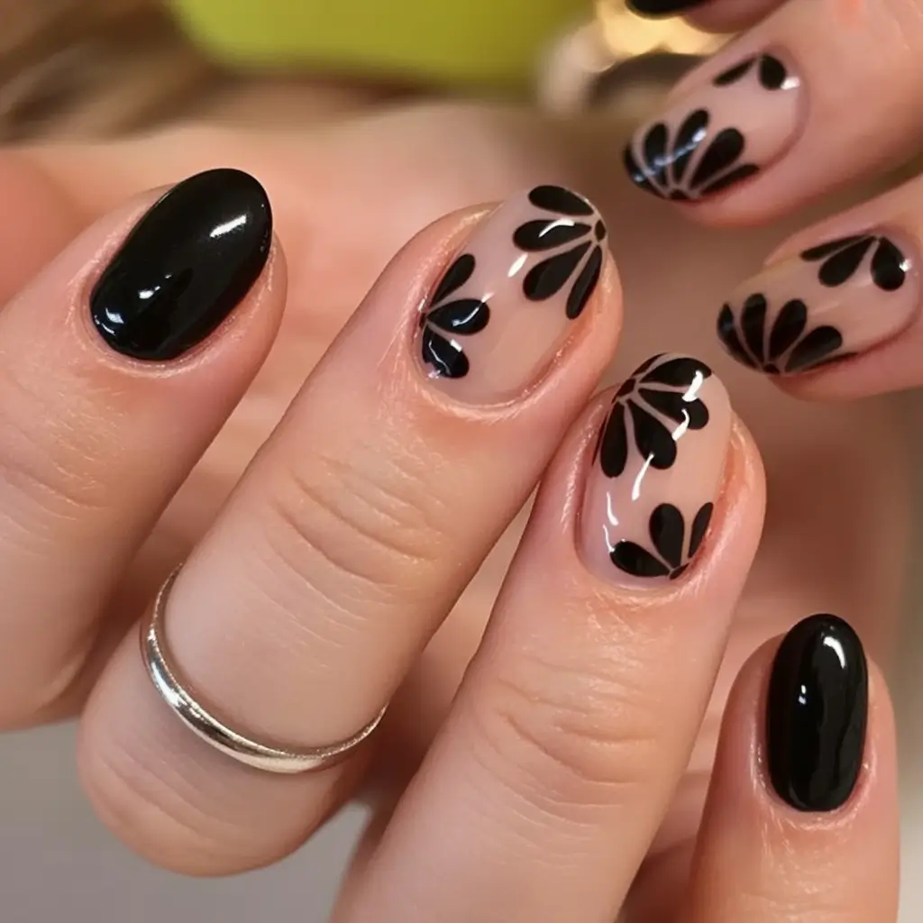 Glossy Gel Nails for Summer 2025 Graphic Black Petals On A Glossy Nude Base