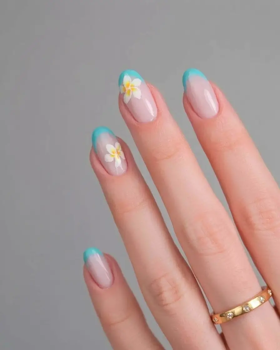 nail inspo for summer 2025 Beachy Blue French With Floral Accent