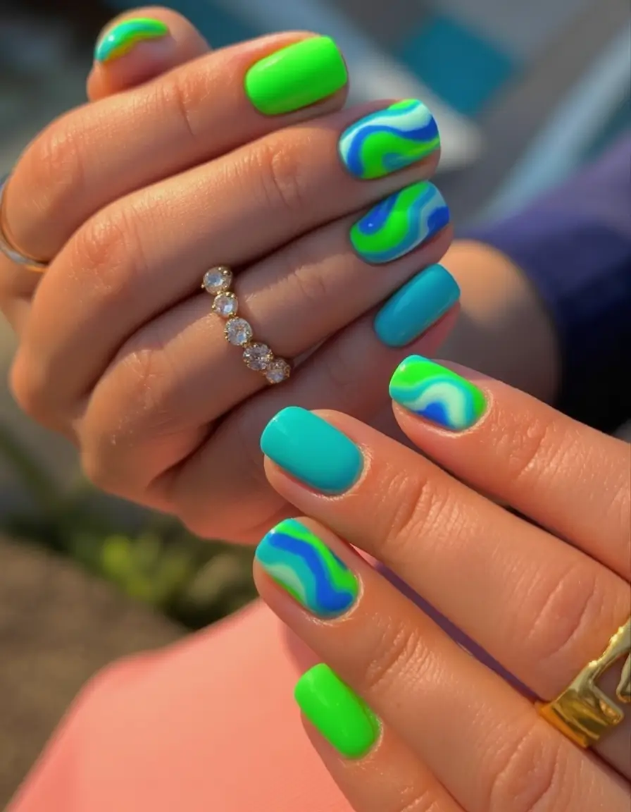 Neon Nails That Pop in 2025 Wave Print Swirls in Green and Blue