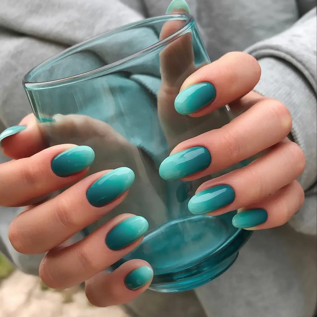 Ombre nails made for summer 2025 Teal Ombré On Almond Nails With Cool Depth