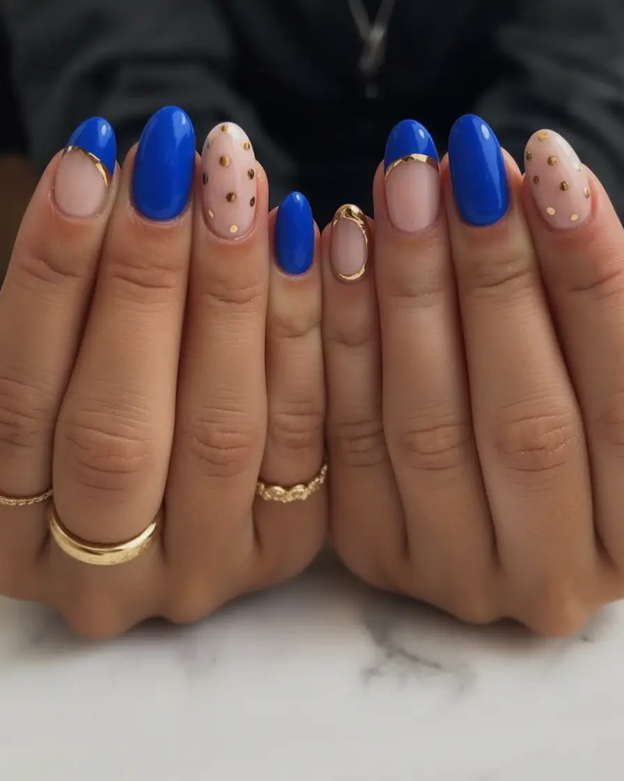 Oval Nail Looks for Summer 2025 Royal Blue Edge With Gold Confetti