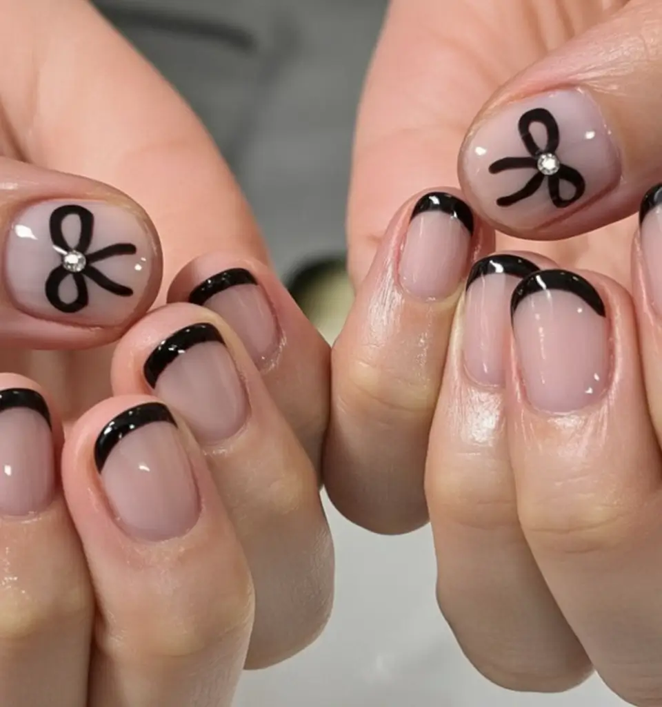 Round Nail Inspo for Summer 2025 Classic Noir with a Bow Twist