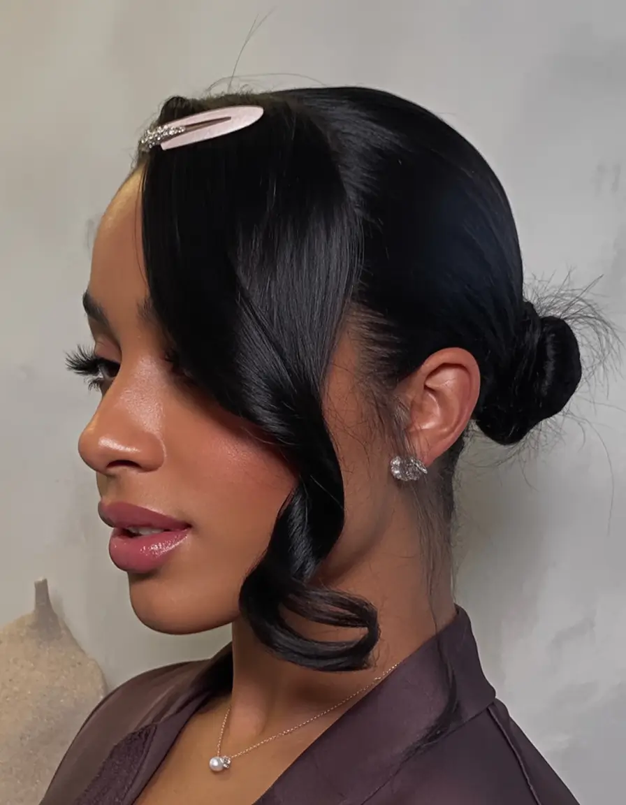 Simple Bun Hairstyle Inspirations - Summer 2025 Low Bun with Sleek Side Curl