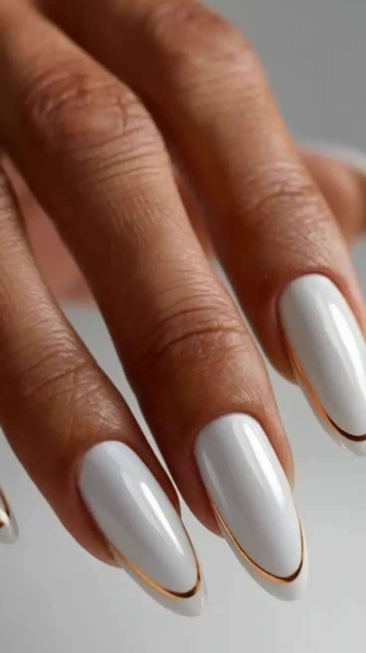 White Nails Made for Summer 2025 Golden Lined Almond Drama