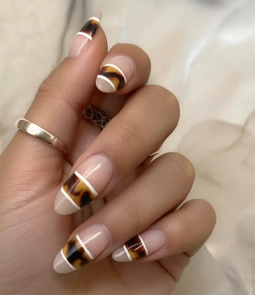 Nail Designs to Try in August 2025 Glossy Tortoise Tips with Graphic Edges